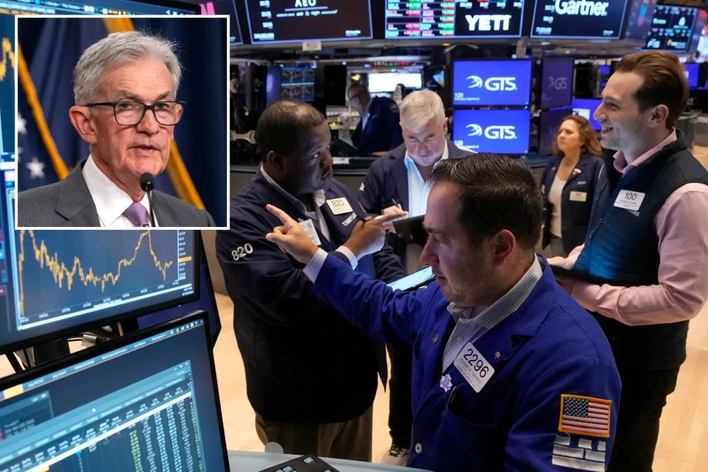 Dow leaps to all-time high after Fed slashes rates by half-point